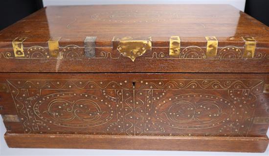 A large Indian brass inlaid teak vanity box, late 19th century, with fitted interior, 54.5cm wide
